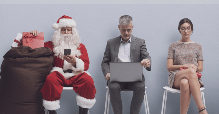 two people waiting for a job interview and a santa claus waiting next to them