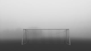 Football goal, black and white photo.