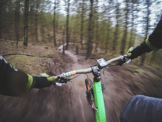 Green off road bicycle, dirt path.