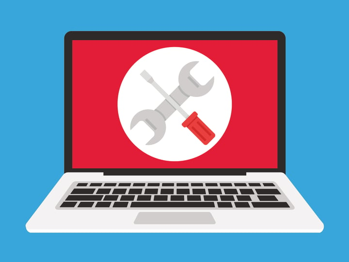 A laptop showing an image of a spanner and screwdriver